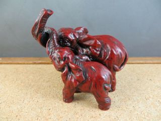 Vintage Red Resin Faux Cinnabar Double Elephant Figurine Trunks Up Together 2