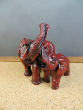 Vintage Red Resin Faux Cinnabar Double Elephant Figurine Trunks Up Together 3