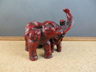 Vintage Red Resin Faux Cinnabar Double Elephant Figurine Trunks Up Together 4