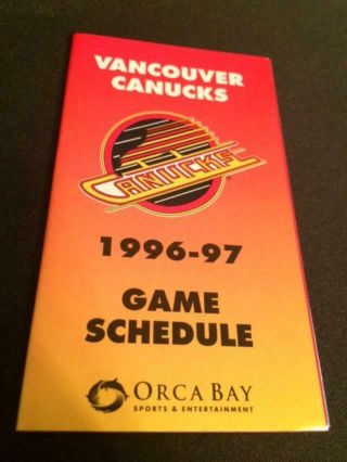 1996 - 97 Vancouver Canucks Hockey Pocket Schedule Sports Action Version