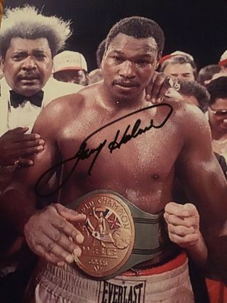Larry Holmes Autographed Photo.  Certified