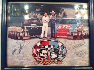 Dale Earnhardt And Richard Petty Autographed Championship Photo.