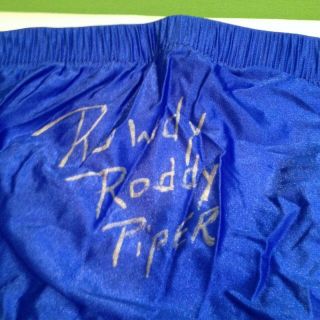 WWE WWF ROWDY RODDY PIPER SIGNED WRESTLING BLUE TRUNKS WITH 2