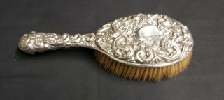 An Antique Solid Silver Grooming Brush With Embossed Patterns.  Birmingham 1902.