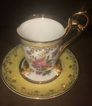 Vintage 3 Footed Floral Demitasse Cup And Saucer.  Yellow With Gold Accent.
