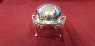 A Vintage Silver Plated Roll Top Butter Dish With Engraved Patterns.