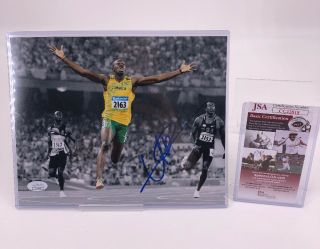 Autographed/ Signed Usain Bolt 8x10 Photo Olympic Gold Jsa Rare Top Loader