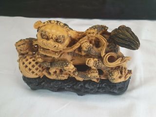 Vintage Resin Chinese Dragon And Babies Mounted On A Black Plinth