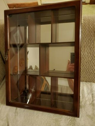 Curio Cabinet With Mirrored Back Drop