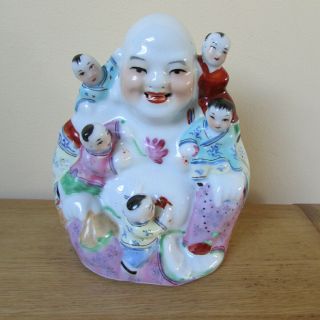 Chinese Porcelain Figure Of A Smiling Buddha With Children,  Numbered On Base