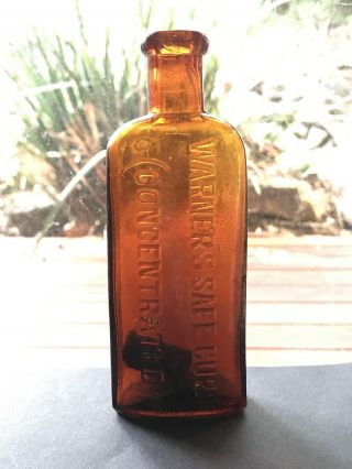 Antique Medicine Bottle Embossed Warner’s Safe Cure (concentrated) Amber 14.  5cm