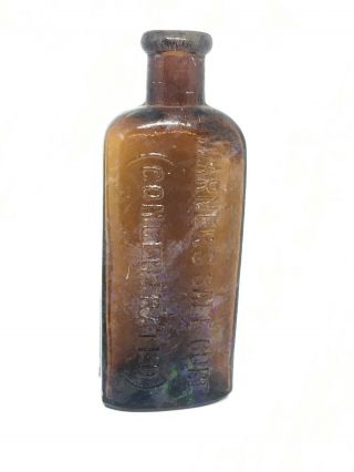 Antique Amber Bottle Embossed WARNER’S SAFE CURE (CONCENTRATED) with SAEE Error 3