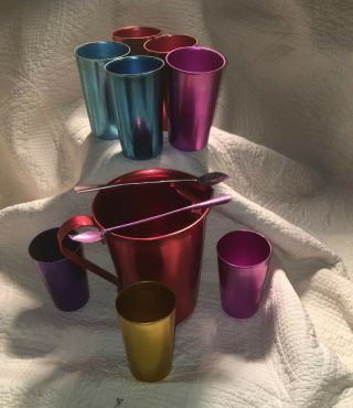 8 Vintage Bascal Tumblers Cups With 2 Spoons And A Antique Color Craft Pitcher.