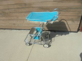 Chromed Metal Baby Push Stroller With Turquoise Vinyl Covered Top Wire Basket