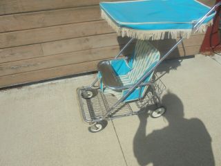 chromed metal baby push stroller with turquoise vinyl covered top wire basket 2