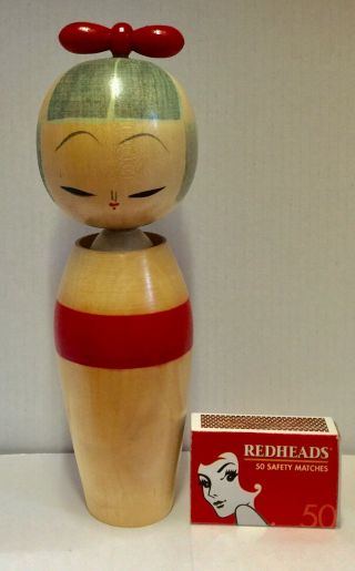 Kokeshi Doll Japanese Vintage 7 3/8”.  Red Obi & Bow.  Stamp On Base.