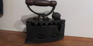 Antique Coal Sad Iron With Wooden Handle.  Soldier/ Conquistador Profile/ Head