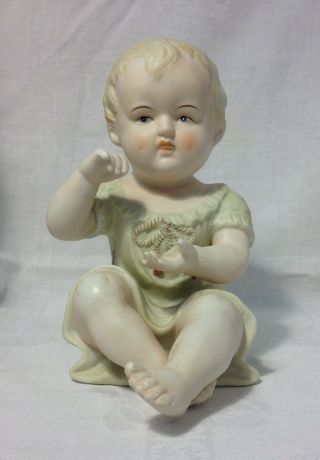 Antique German Bisque Porcelain Piano Baby Figurine / 7 Inches Tall / Vintage