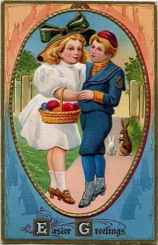 Antique Easter Postcard Boy & Girl Embrace Colored Eggs Rabbits Gold Embossed