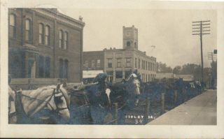 Antique Rppc Postcard Sibley Ia " Long Line Horses Hitched Up On The Street "