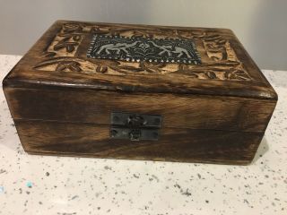 Old Wooden Box With Metal Hinges And Metal Elephants Decorative Panel