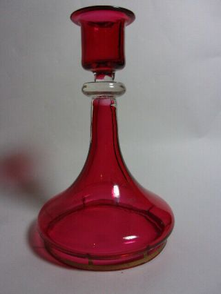 An Antique Cranberry Glass Candlestick.