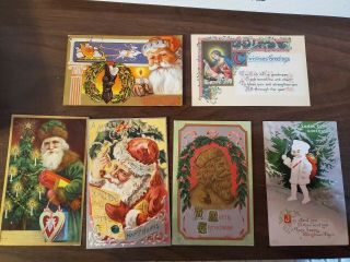 6 Antique Christmas Santa Postcards - - Early 1900s.  Size 3 X 5
