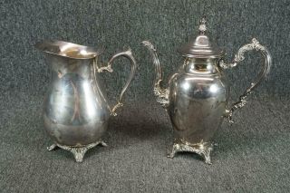 W.  M.  Rogers Silver Plated Set Of Two Pitchers One With Lid