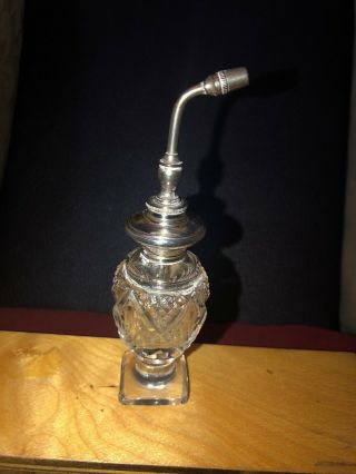 Antique Silver Mounted Cut Glass Atomiser Of Shaped Form With A Square Base