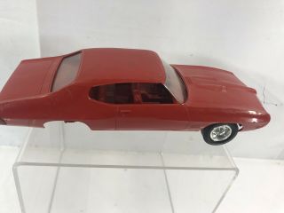 VINTAGE.  1960s.  PONTIAC GTO.  RED IN COLOR 3