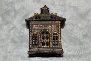 T 2.  Antique Cast Iron 1889 Arcade Cast Iron State Bank Coin Bank 4.  5 "