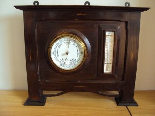 An Antique Edwardian Oak Aneriod Barometer And Termometer Standing Set