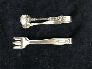 2 Vintage Silver Plate Sugar Tongs.  One Wm A Rogers,  Other Unmarked
