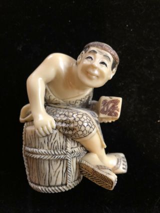 Japanese Ivory Colored Bone Netsuke - Large Man Sitting On A Wood Barrel