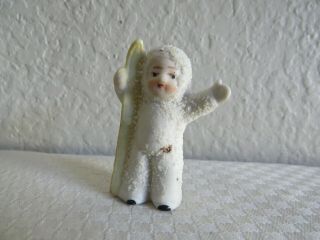 Antique German Bisque Porcelain Snow Baby Figurine Holding Ski 
