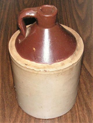 Antique Stoneware Pottery Crock Whiskey Jug With Brown And Grey Glaze.