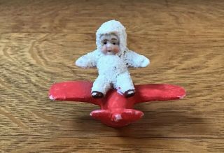 Antique German Bisque Snow Baby On Airplane Repaired