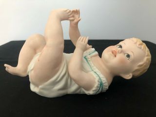Vintage Piano Baby Bisque Porcelain Figurine Lying On Back With Big Eyes 7536