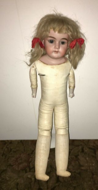Antique Bisque Doll With Leather Body,  Blonde Hair Wig,  Brown Eyes
