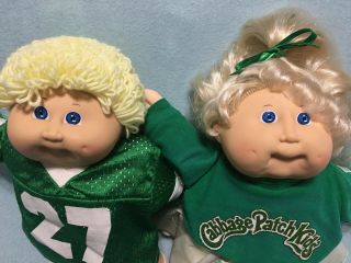 Cabbage Patch Kids Pair Blue Eyed Boy And Girl In Sport Outfits,  Holding Thumb
