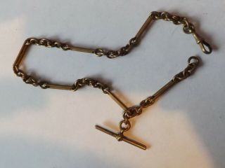 An Antique Gold Plated Bar Link Watch Chain With T Bar And Clip