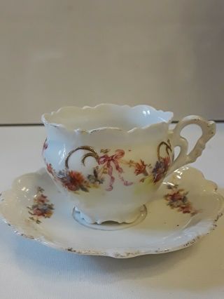 Antique Small Tea Cup And Saucer White With Floral Design.  Unsigned
