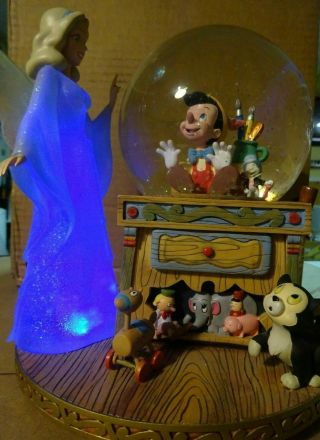Rare Disney Pinocchio & Blue Fairy Snow Globe Musical " Toyland " Lights Work