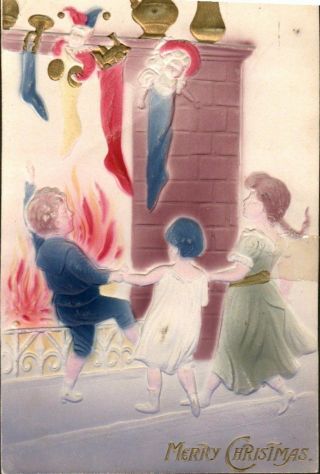 Antique Vintage Christmas Postcard Children Around The Fireplace Embossed