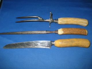 Antique Steel And Elk Horn Carving Set,  Knife,  Meat Fork And Knife Sharpener
