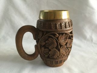 Black Forest Carved Wooden Tankard With Copper Insert.