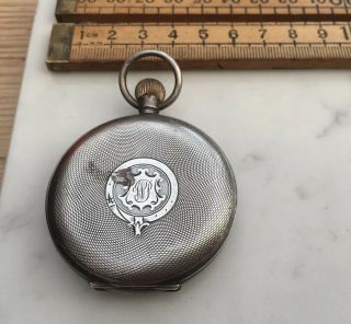 An Antique Silver Pocket Watch Case With Spare Parts