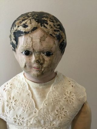 21” papier mache unmarked doll,  black hair,  very dark glass eyes 2