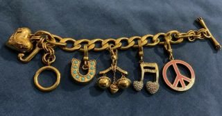 Juicy Couture Gold Tone Horse Shoe Heart Charm Bracelet With Rare Libra Charm.