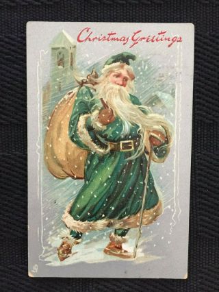 Antique Tuck Christmas Postcard - Green Coat Santa Carrying Pack Of Toys In Snow